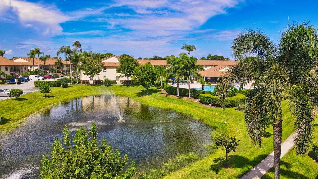 1402 Pinecrest Circle, Unit B Jupiter, FL 33458 - Photo 36 of 56 a view of a lake with houses