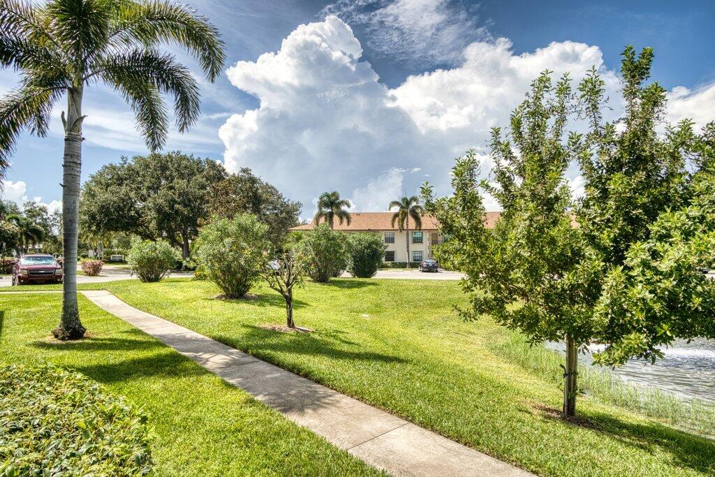 1402 Pinecrest Circle, Unit B Jupiter, FL 33458 - Photo 38 of 56 a view of a park with large trees