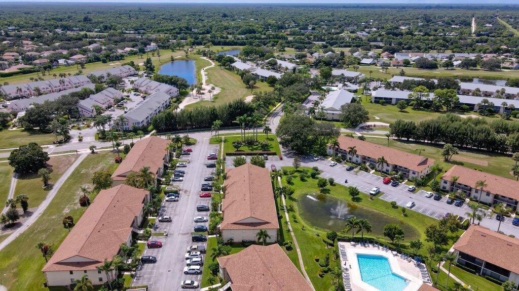1402 Pinecrest Circle, Unit B Jupiter, FL 33458 - Photo 48 of 56 an aerial view of residential houses with outdoor space