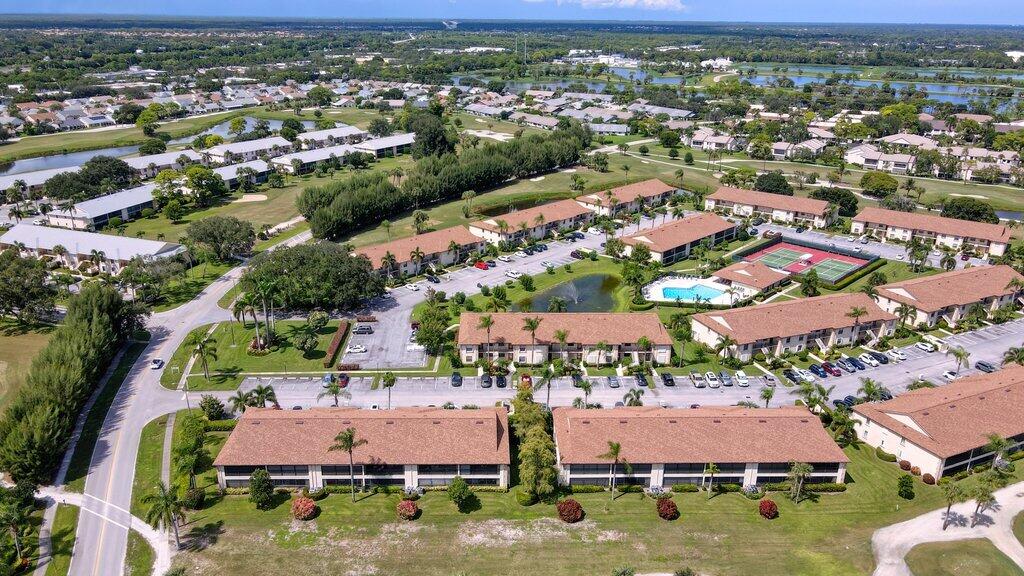 1402 Pinecrest Circle, Unit B Jupiter, FL 33458 - Photo 50 of 56 an aerial view of residential houses with outdoor space