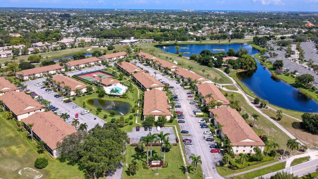 1402 Pinecrest Circle, Unit B Jupiter, FL 33458 - Photo 52 of 56 an aerial view of residential houses with outdoor space