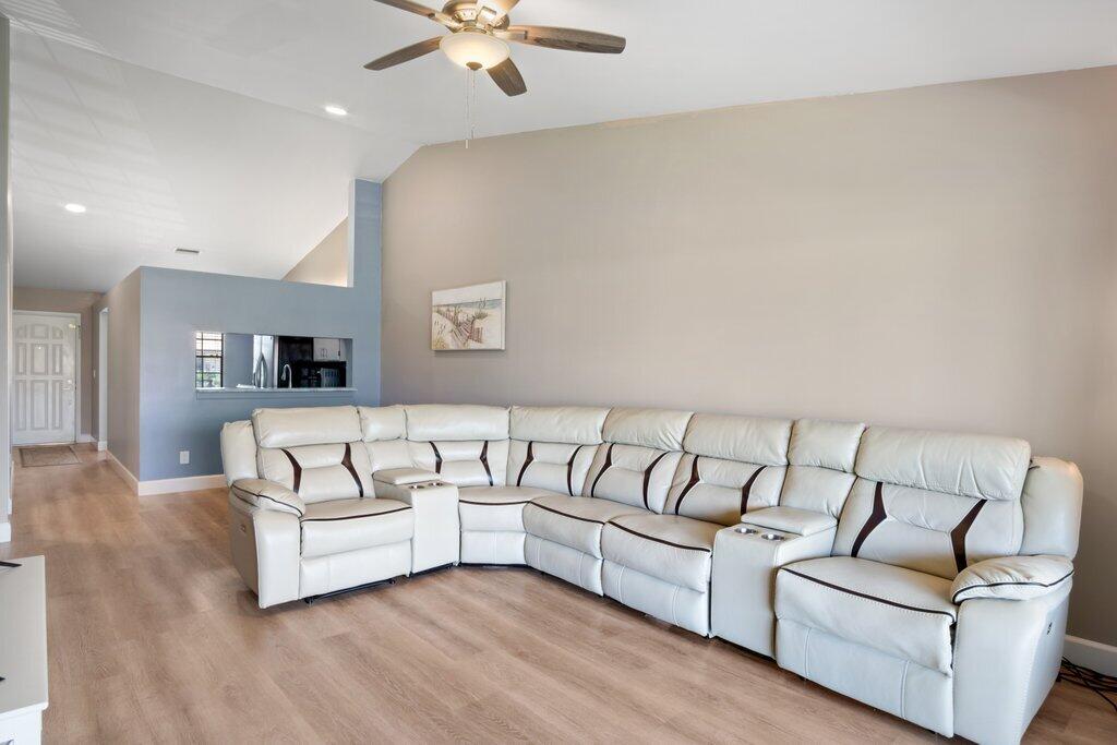 1402 Pinecrest Circle, Unit B Jupiter, FL 33458 - Photo 7 of 56 a living room with furniture and a couch