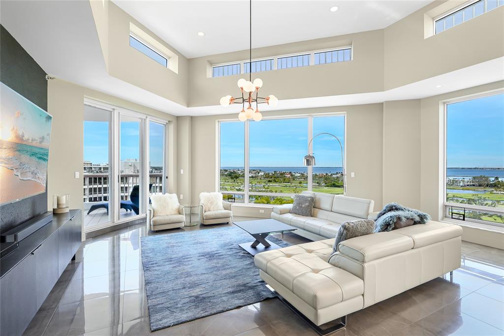 455 Longboat Club Road, Unit PH8 Longboat Key, FL 34228 - Photo 13 of 64 a living room with furniture and a large window