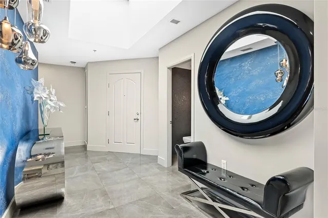 a bathroom with a granite countertop sink and a toilet