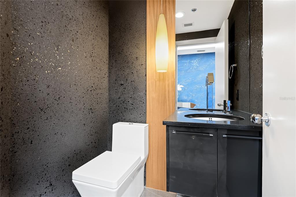 455 Longboat Club Road, Unit PH8 Longboat Key, FL 34228 - Photo 15 of 64 a bathroom with a granite countertop sink and a toilet