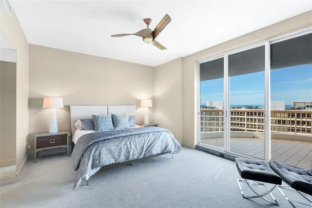 a very nice looking room with a large bed and a large window