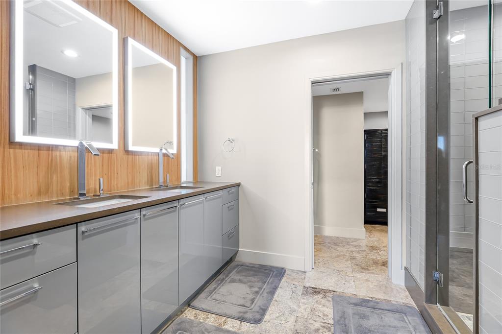 455 Longboat Club Road, Unit PH8 Longboat Key, FL 34228 - Photo 18 of 64 a bathroom with a sink and a mirror