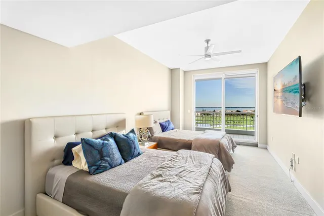 a bathroom with a granite countertop sink a toilet a mirror and shower