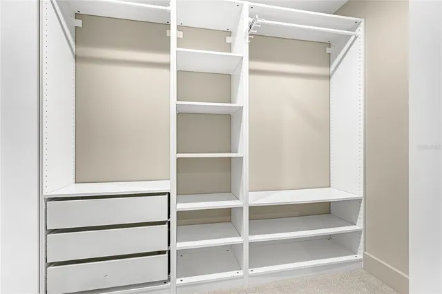 a view of an empty walk in closet