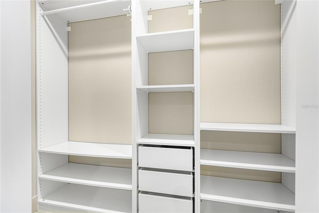 455 Longboat Club Road, Unit PH8 Longboat Key, FL 34228 - Photo 28 of 64 a view of walk in closet with empty racks