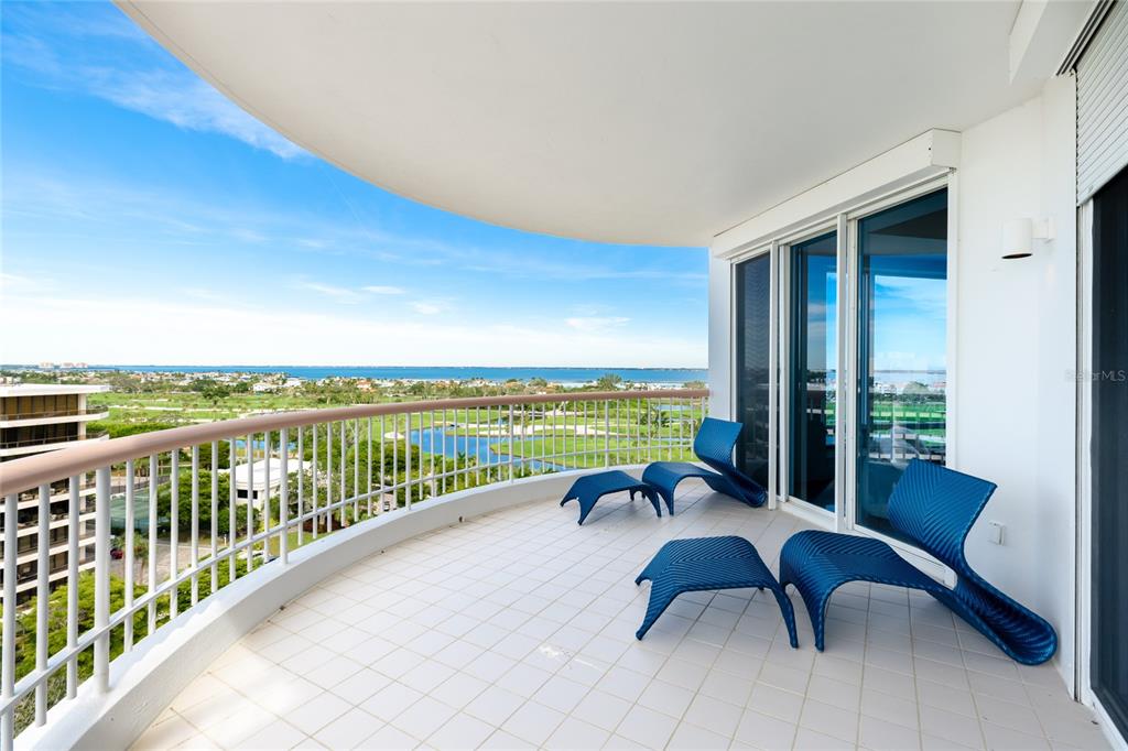 455 Longboat Club Road, Unit PH8 Longboat Key, FL 34228 - Photo 30 of 64 a view of a balcony with furniture and pool