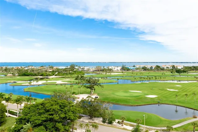 a front view of a multi story residential apartment building with yard
