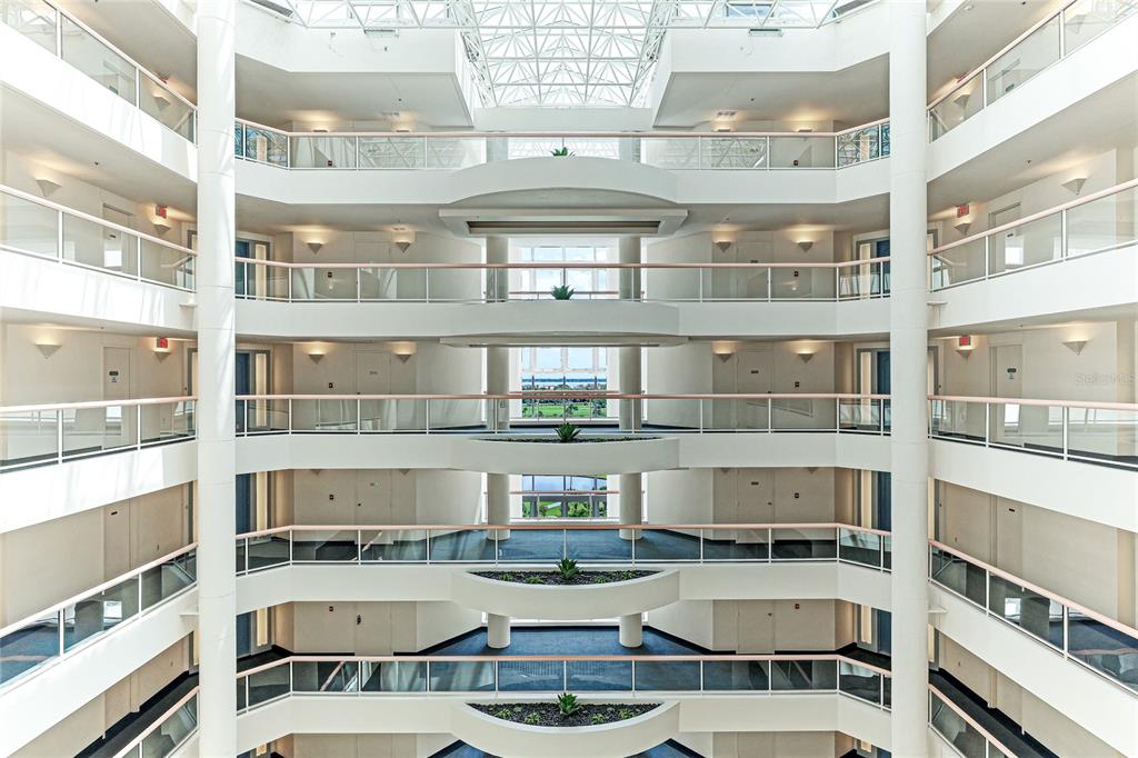 455 Longboat Club Road, Unit PH8 Longboat Key, FL 34228 - Photo 43 of 64 a kitchen with a stove a table and chairs