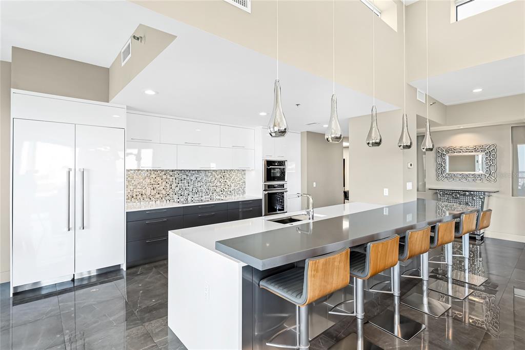 455 Longboat Club Road, Unit PH8 Longboat Key, FL 34228 - Photo 6 of 64 a kitchen with stainless steel appliances granite countertop a sink and a refrigerator
