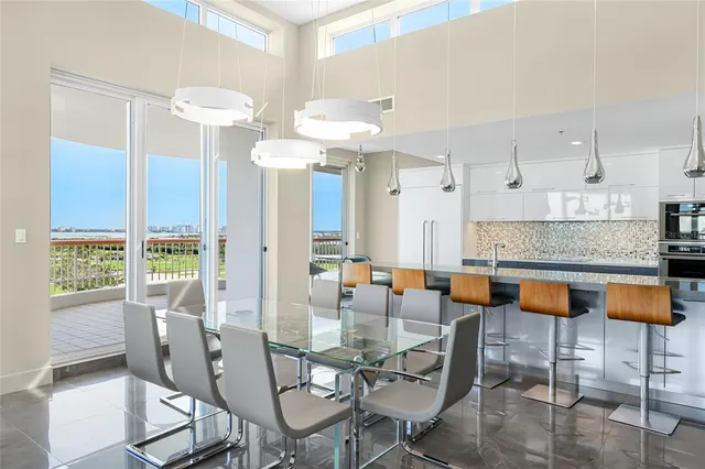 a dining room with furniture and chandelier