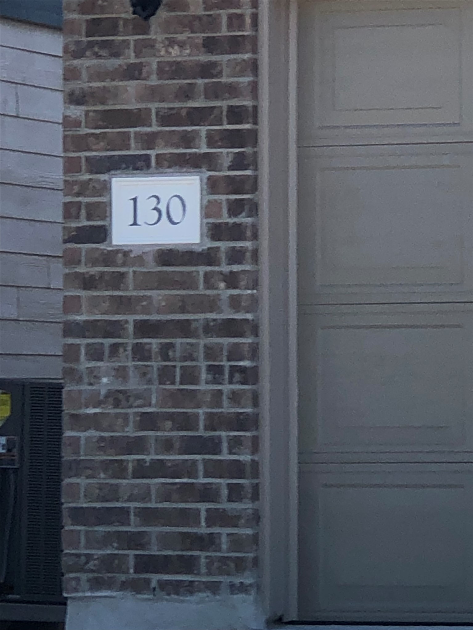 130 Lt Rusty Drive Jarrell, TX 76537 - Photo 2 of 13 A classic brick exterior offers enduring appeal, framing a clear address marker.