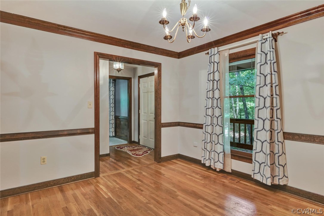 11920 Nash Road Chesterfield, VA 23838 - Photo 9 of 40 Chair rail and crown moulding enhance this room