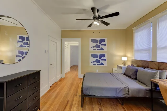 a bedroom with furniture and a fireplace