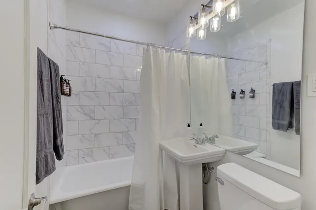 a view of a kitchen with a table and chairs