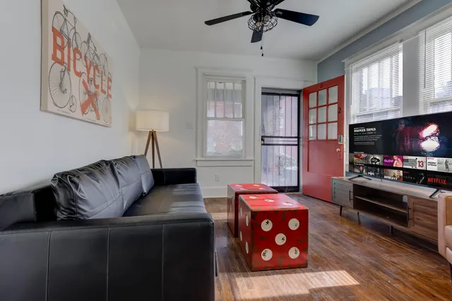 a bedroom with a bed and a tv on table