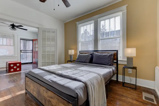 a bedroom with a bed and a couch