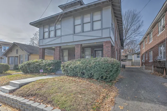 a view of a building with a yard