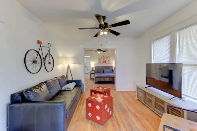 a living room with furniture and a flat screen tv