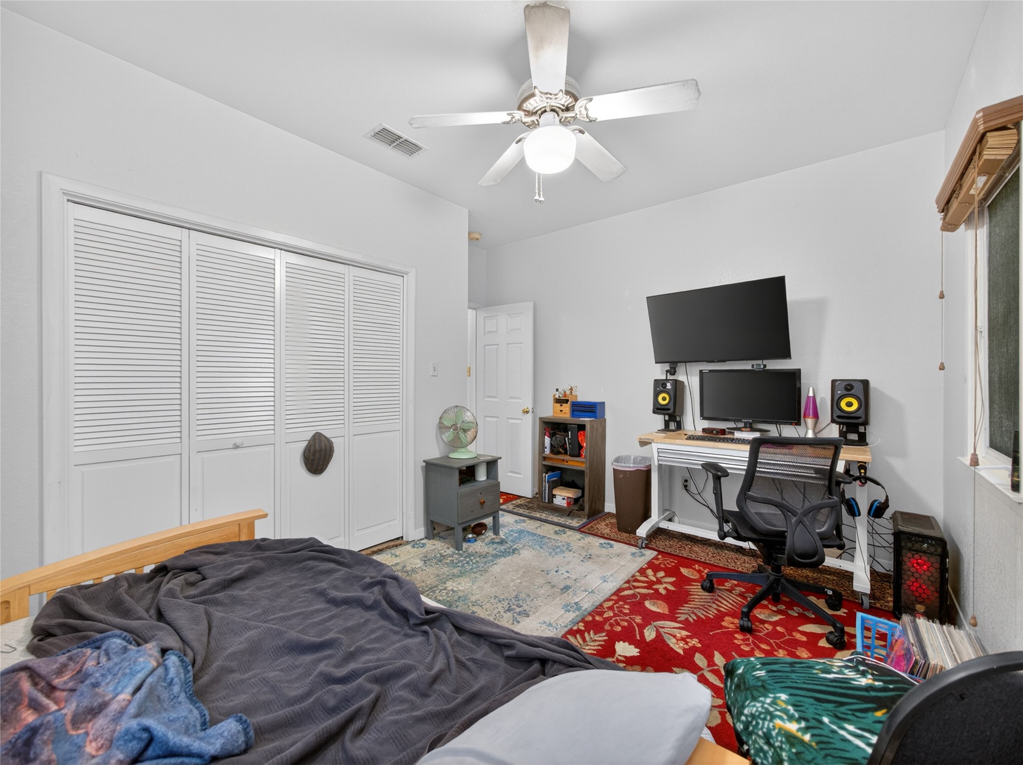 613 Breakaway Road Cedar Park, TX 78613 - Photo 29 of 40 a bedroom with a bed and a flat screen tv