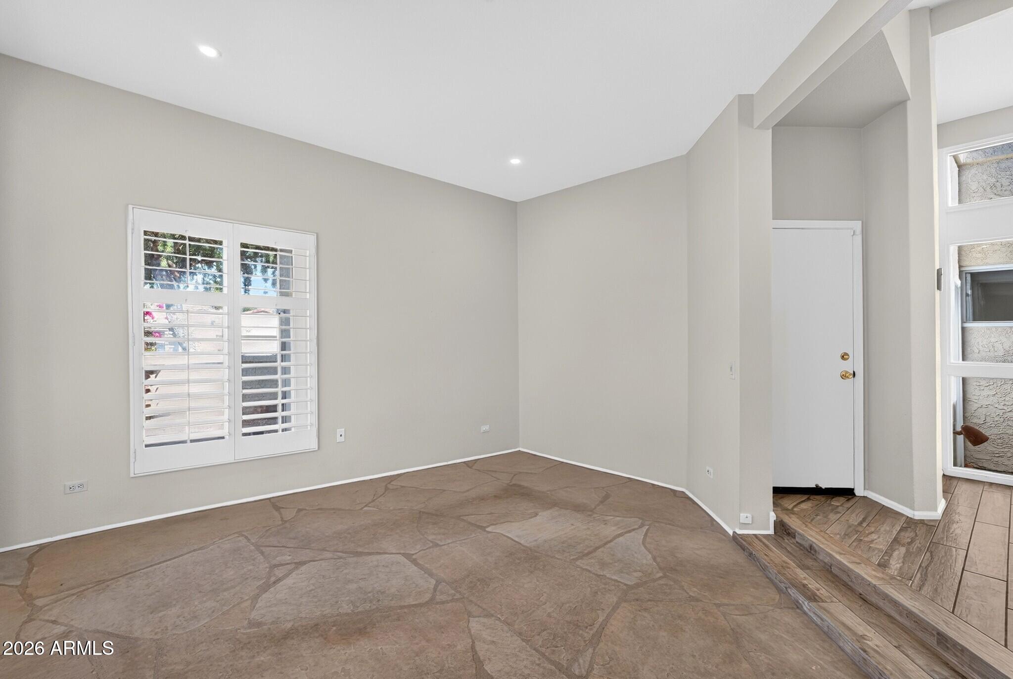 4615 East Monte Way Phoenix, AZ 85044 - Photo 30 of 35 a view of an empty room with a window