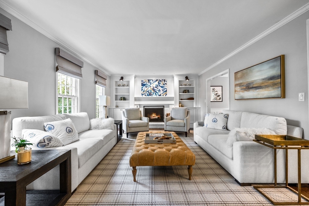 4 Alonesos Way Andover, MA 01810 - Photo 11 of 42 a living room with furniture and a fireplace