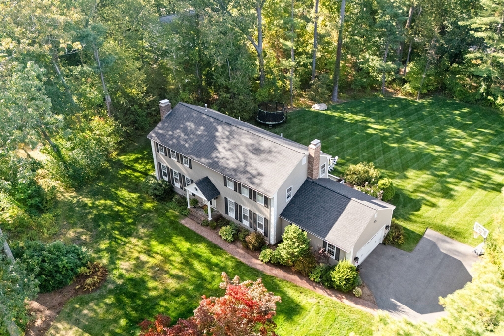4 Alonesos Way Andover, MA 01810 - Photo 2 of 42 a view of a house with a yard and garden