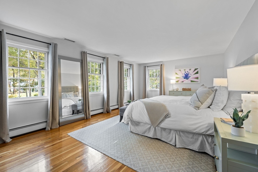 4 Alonesos Way Andover, MA 01810 - Photo 21 of 42 a bedroom with a large bed and wooden floor