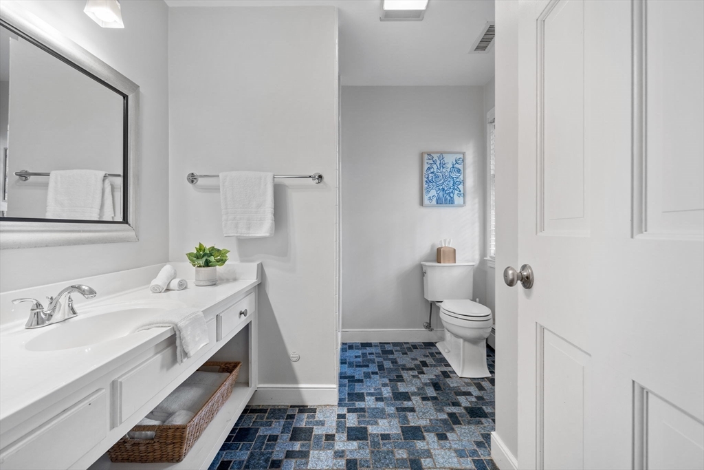 4 Alonesos Way Andover, MA 01810 - Photo 24 of 42 a bathroom with a sink a toilet and a mirror