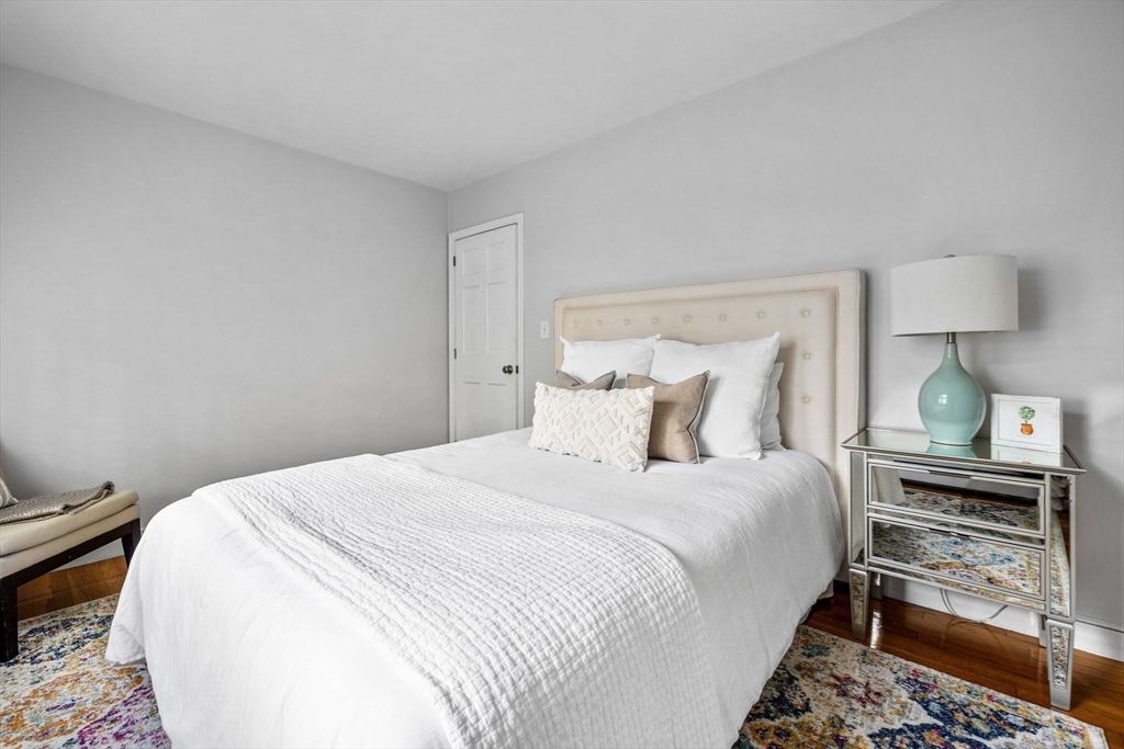 4 Alonesos Way Andover, MA 01810 - Photo 29 of 42 a bedroom with a bed and a lamp