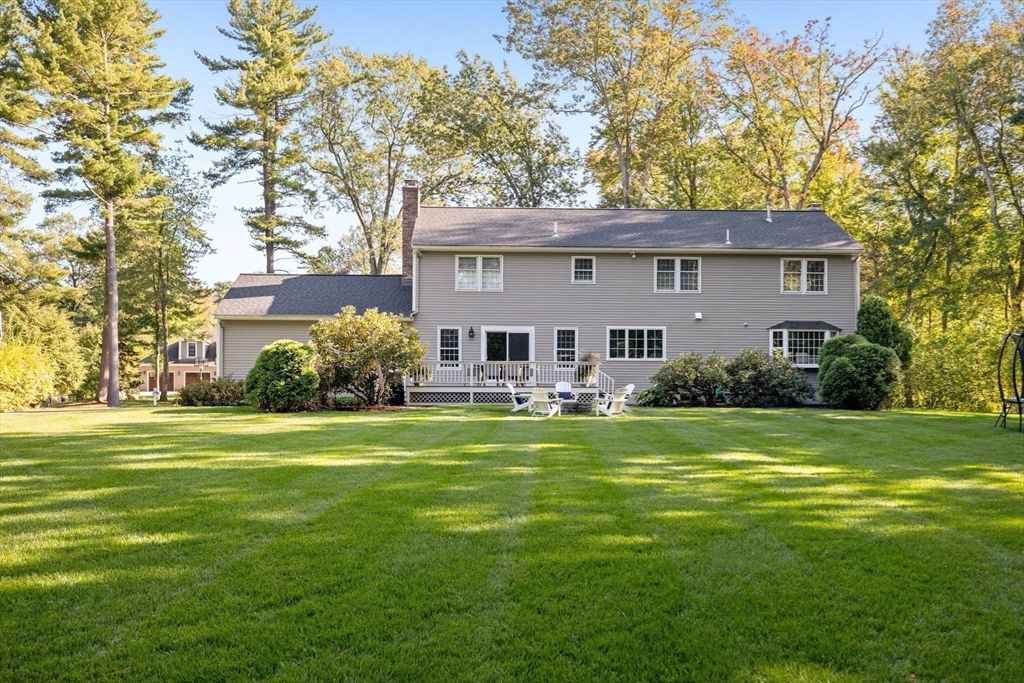 4 Alonesos Way Andover, MA 01810 - Photo 40 of 42 a front view of a house with garden