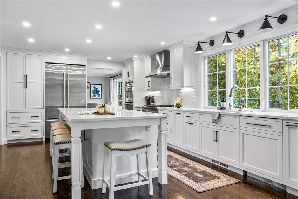 4 Alonesos Way Andover, MA 01810 - Photo 6 of 42 a kitchen with stainless steel appliances granite countertop a stove a sink dishwasher and a refrigerator with wooden floor