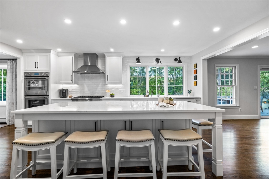 4 Alonesos Way Andover, MA 01810 - Photo 10 of 42 a kitchen with a table and chairs in it