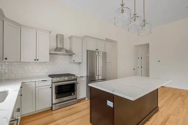 a spacious bedroom with a bed and a couch