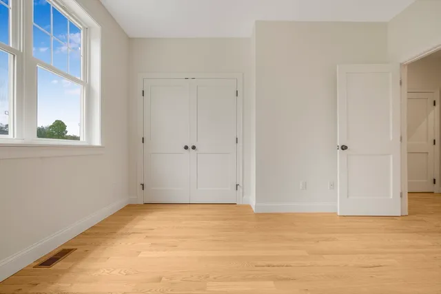 a front view of a residential apartment building with a yard