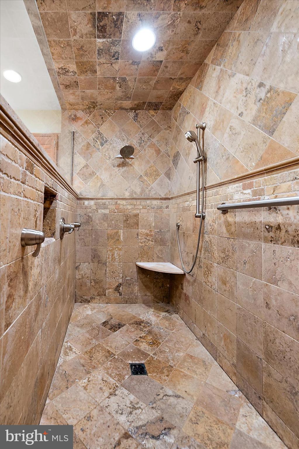 32271 West Road Frankford, DE 19945 - Photo 24 of 56 Elegant stone shower with modern fixtures.