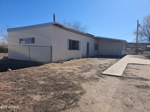 a view of a backyard of the house
