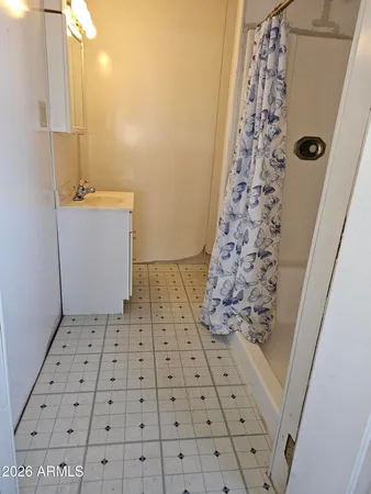 a kitchen with stainless steel appliances granite countertop a sink a stove a refrigerator and cabinets