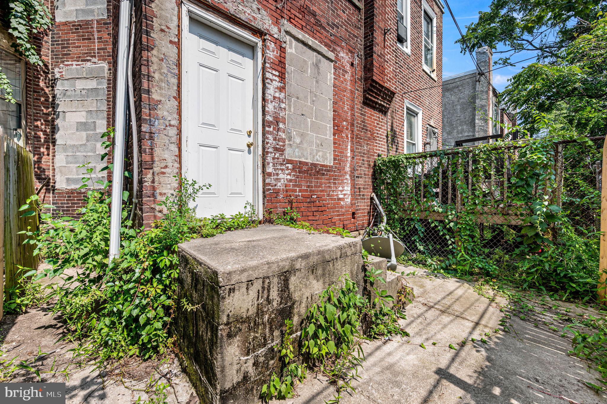 2030 South Cecil Street, Unit 1 Philadelphia, PA 19143 - Photo 11 of 11 a view of a house with potted plants
