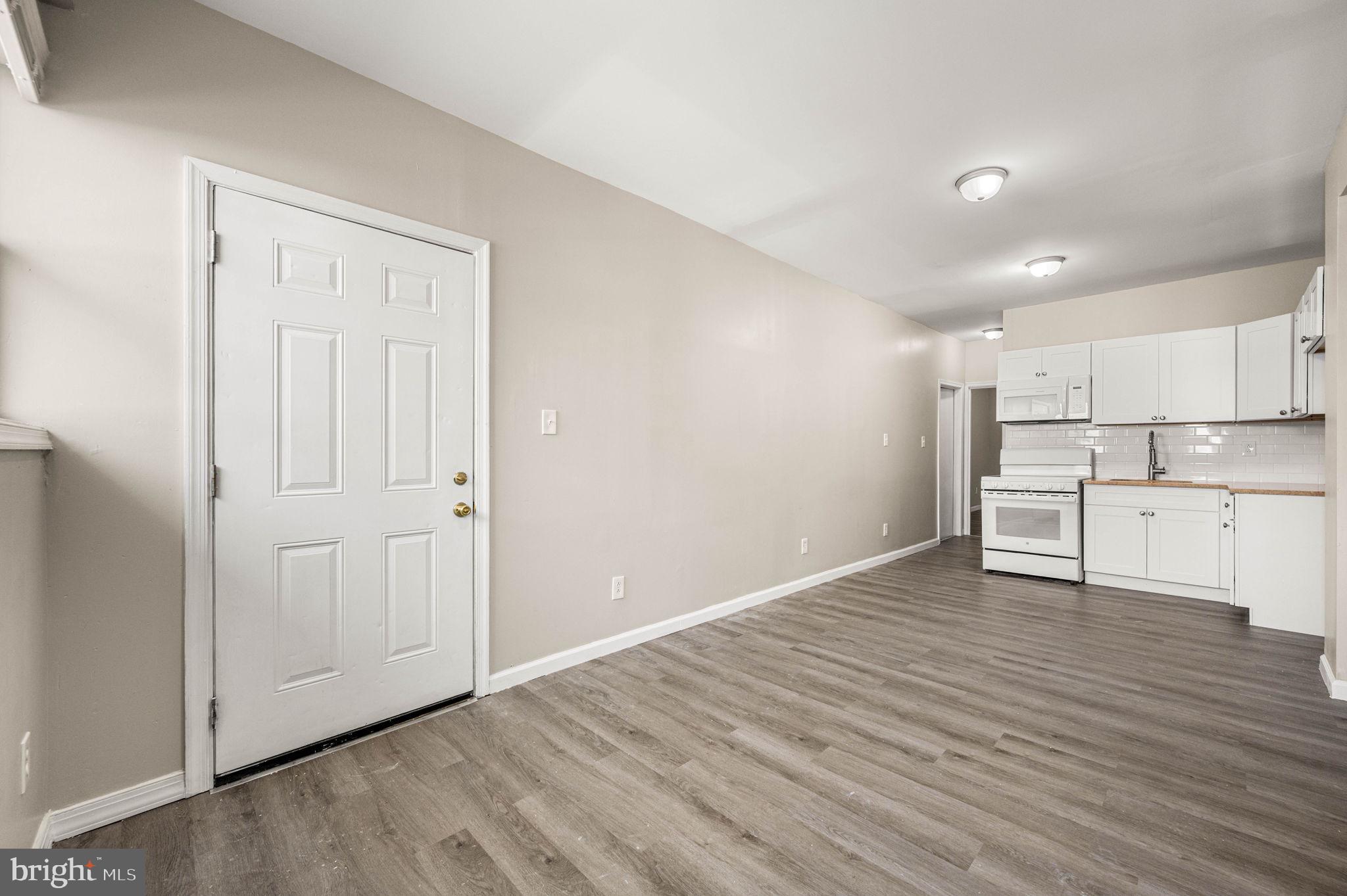 2030 South Cecil Street, Unit 1 Philadelphia, PA 19143 - Photo 3 of 11 a view of kitchen with wooden floor