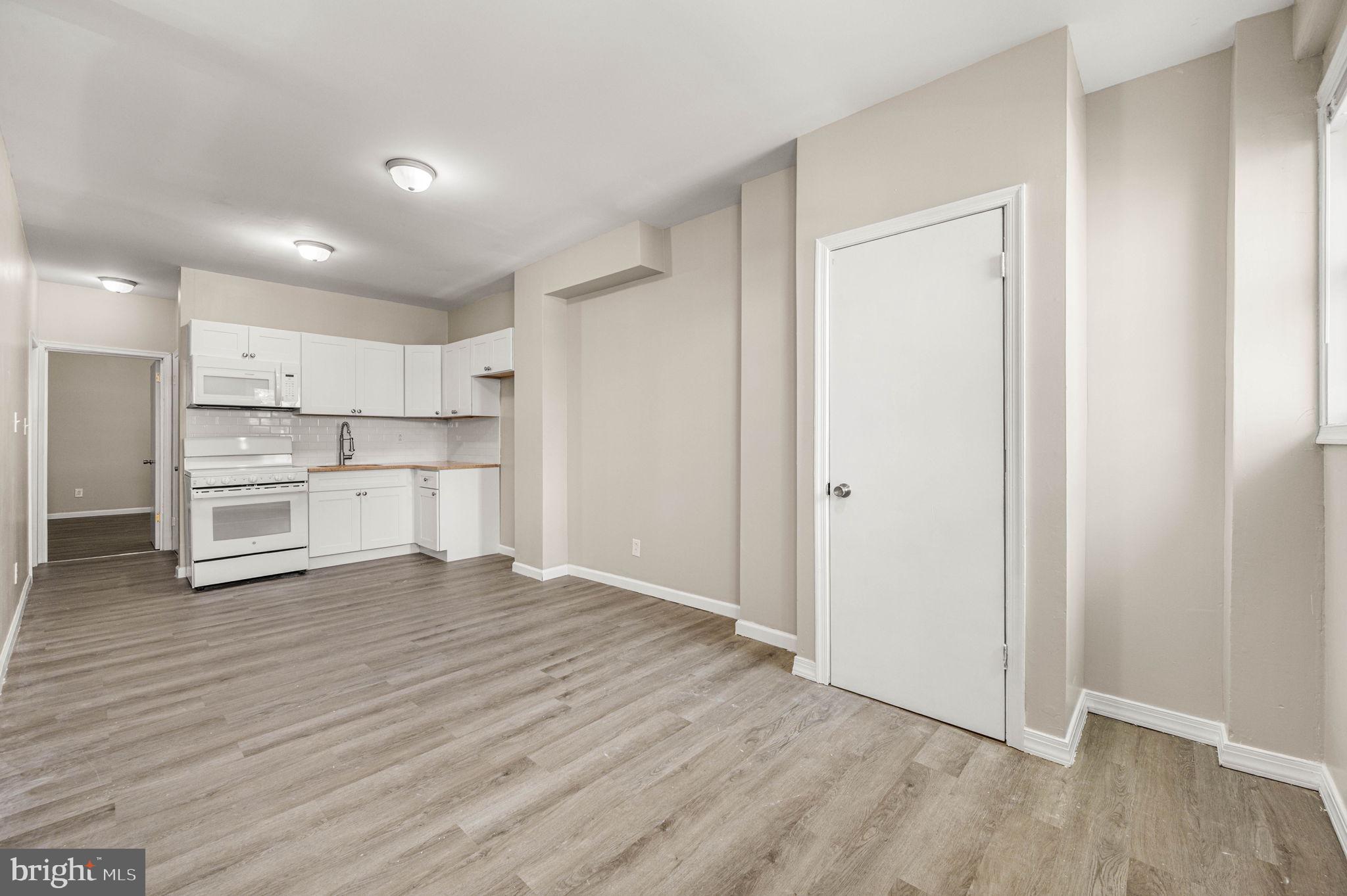 2030 South Cecil Street, Unit 1 Philadelphia, PA 19143 - Photo 4 of 11 a view of kitchen with wooden floor