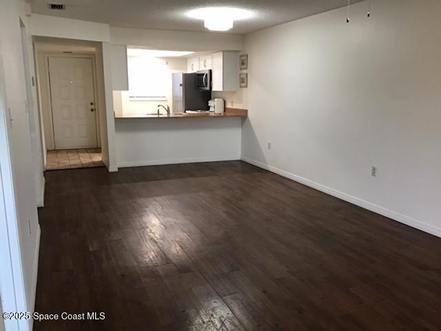 1720 Murrell Road, Unit 207 Rockledge, FL 32955 - Photo 5 of 17 Family room looking toward kitchen