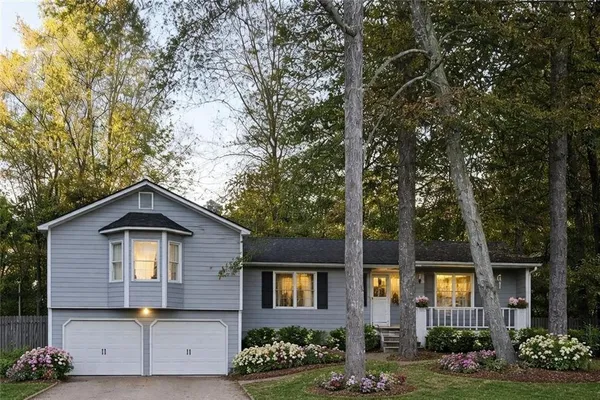 a front view of a house with garden
