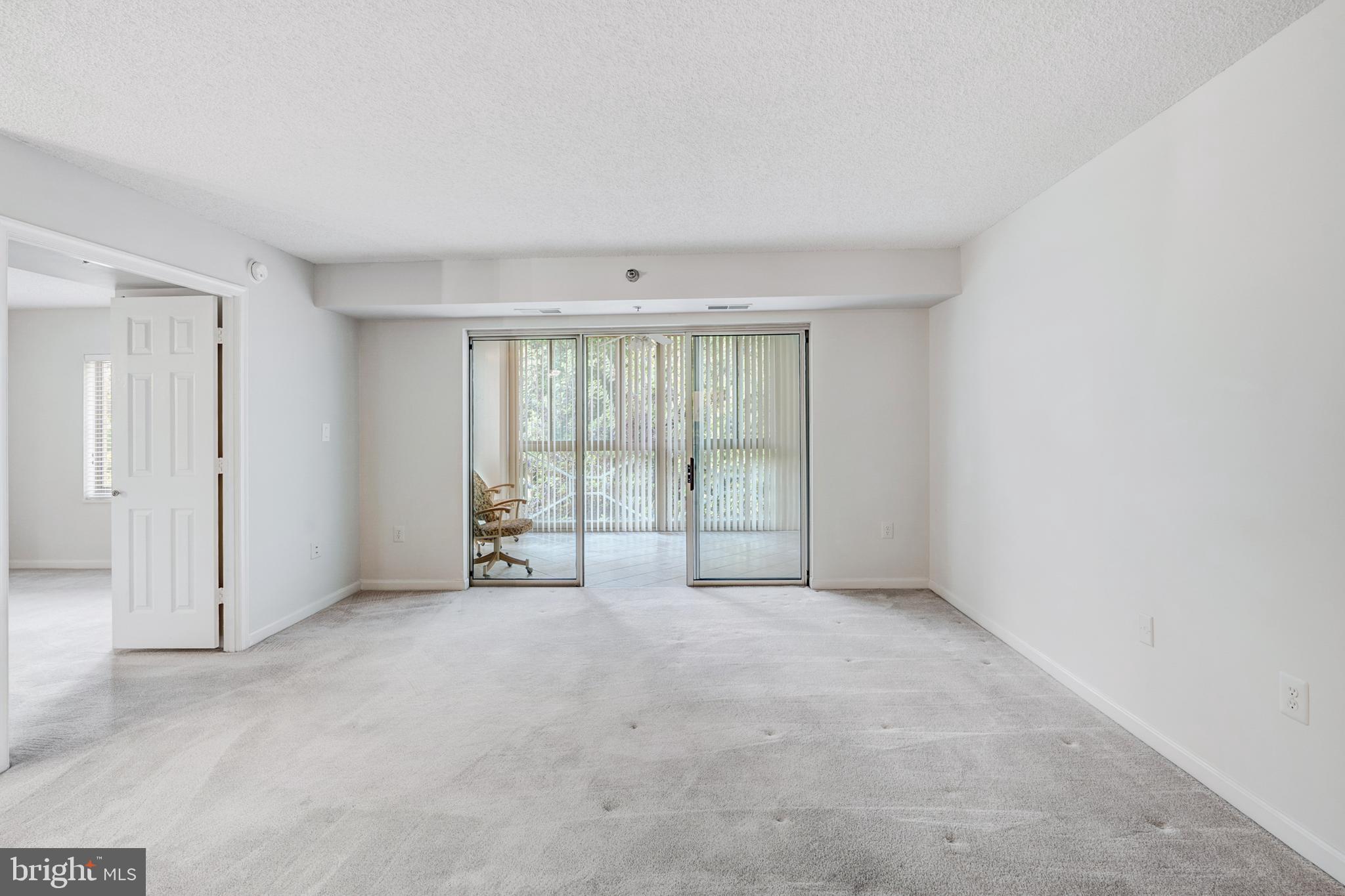 14809 Pennfield Circle, Unit 302 Silver Spring, MD 20906 - Photo 11 of 40 Living Room to Sun Room