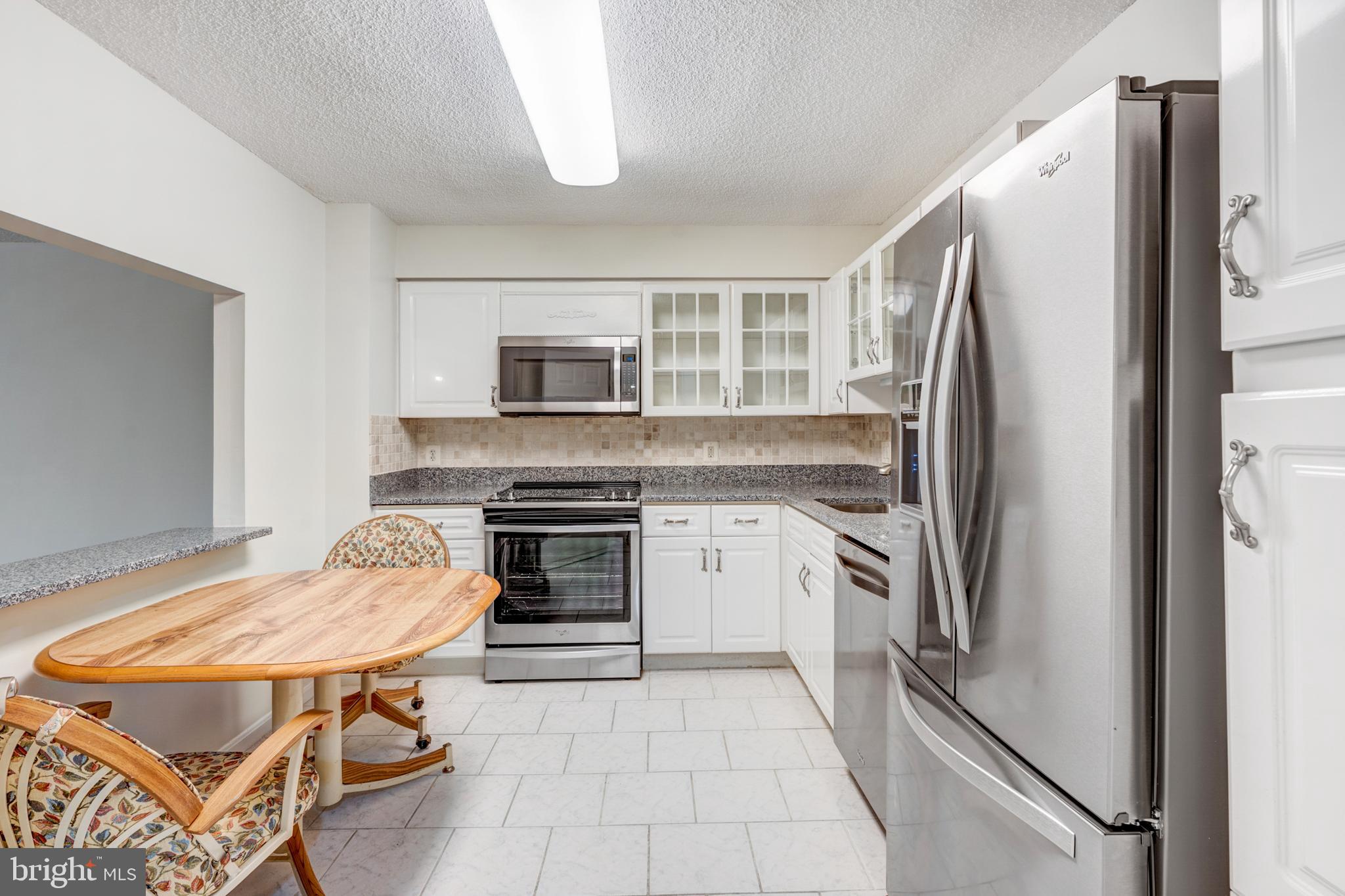 14809 Pennfield Circle, Unit 302 Silver Spring, MD 20906 - Photo 8 of 40 Kitchen with Pass Thru