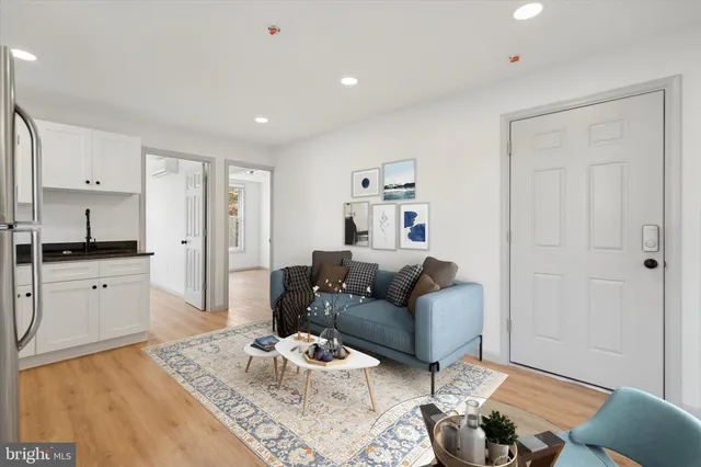 a living room with furniture and a rug